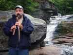 bob by water fall playing native american flute